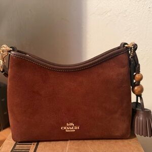 Brand new Coach brown suede crossbody bag